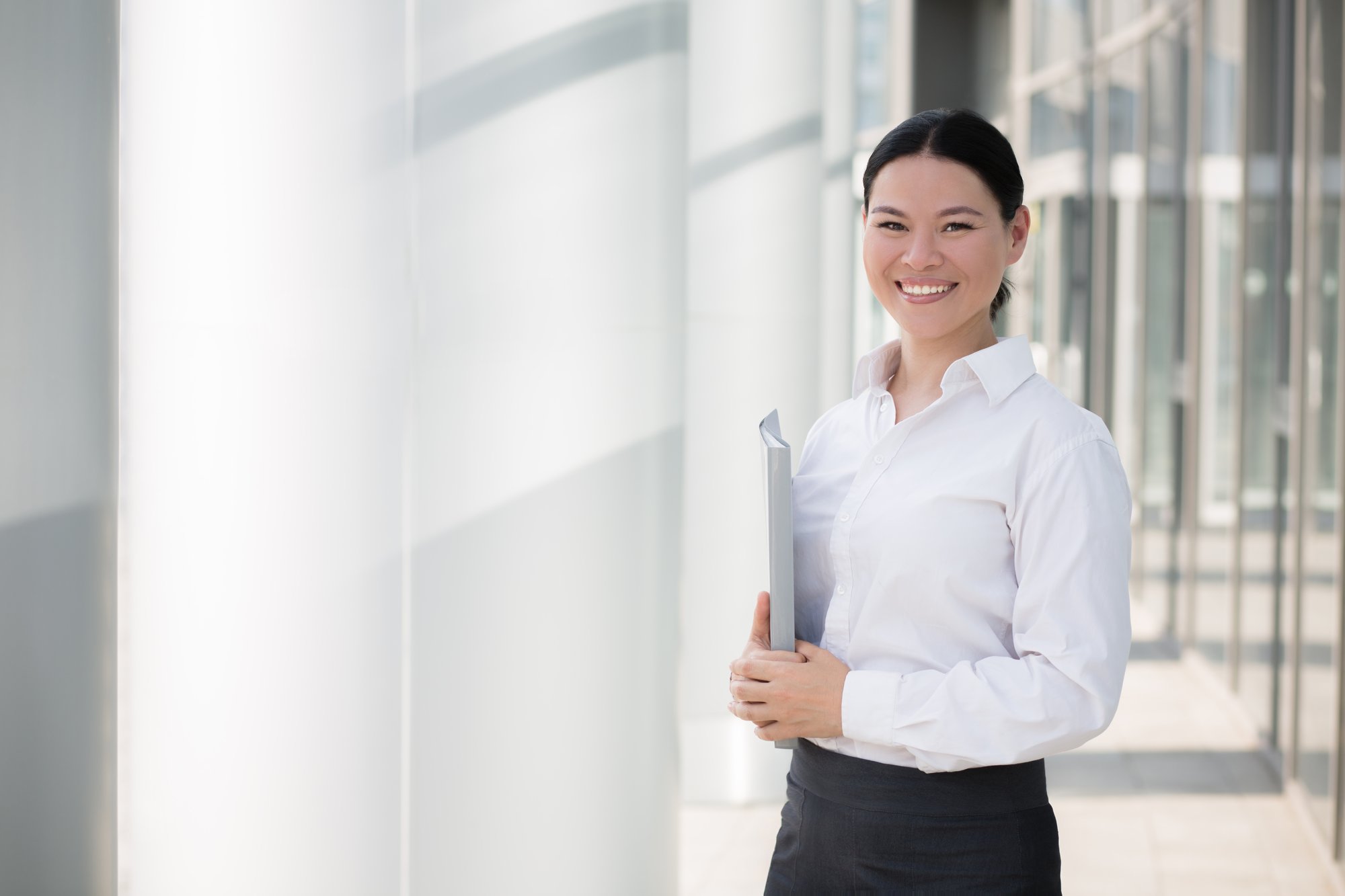 asian-businesswoman-smiling-with-file-her-hands